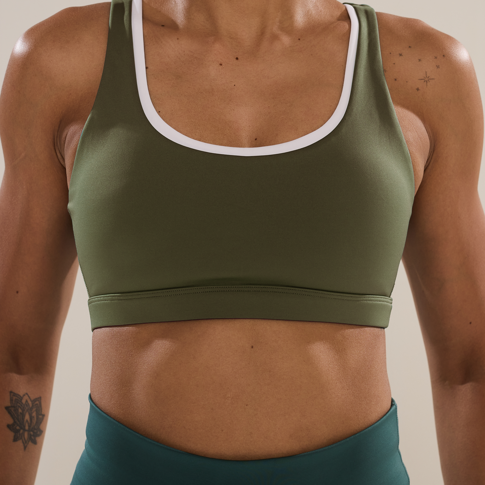 Anya Active Circle Back Layered Bra in Olivine, women's olive green sports bra with white layered trim, front view